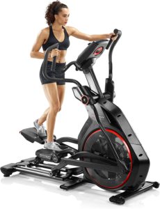 Elliptical machine ratings reviews. The picture of a woman engaging her Bowflex 116 Elliptical trainer.